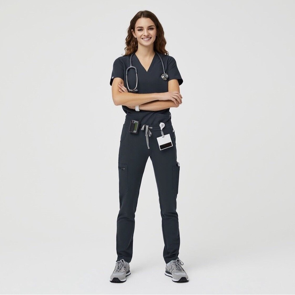 Wear figs Casma scrub top in dark harbor with matching Yola scrub pants